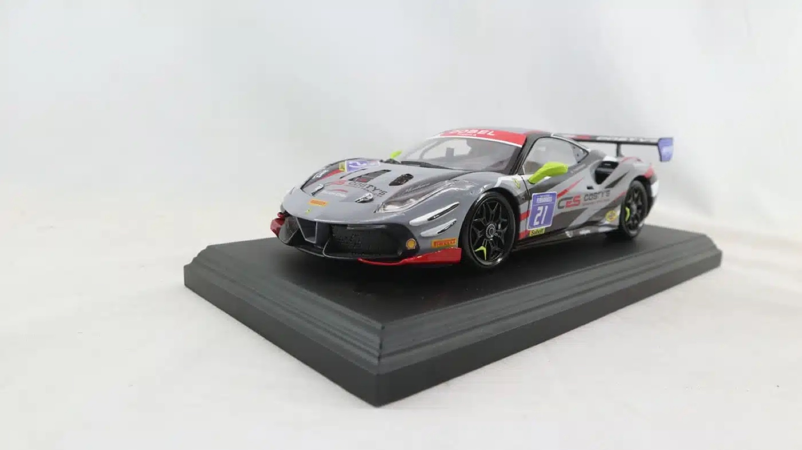 A hand-finished scale model of a Ferrari 488 Challenge Evo race car in sponsor livery