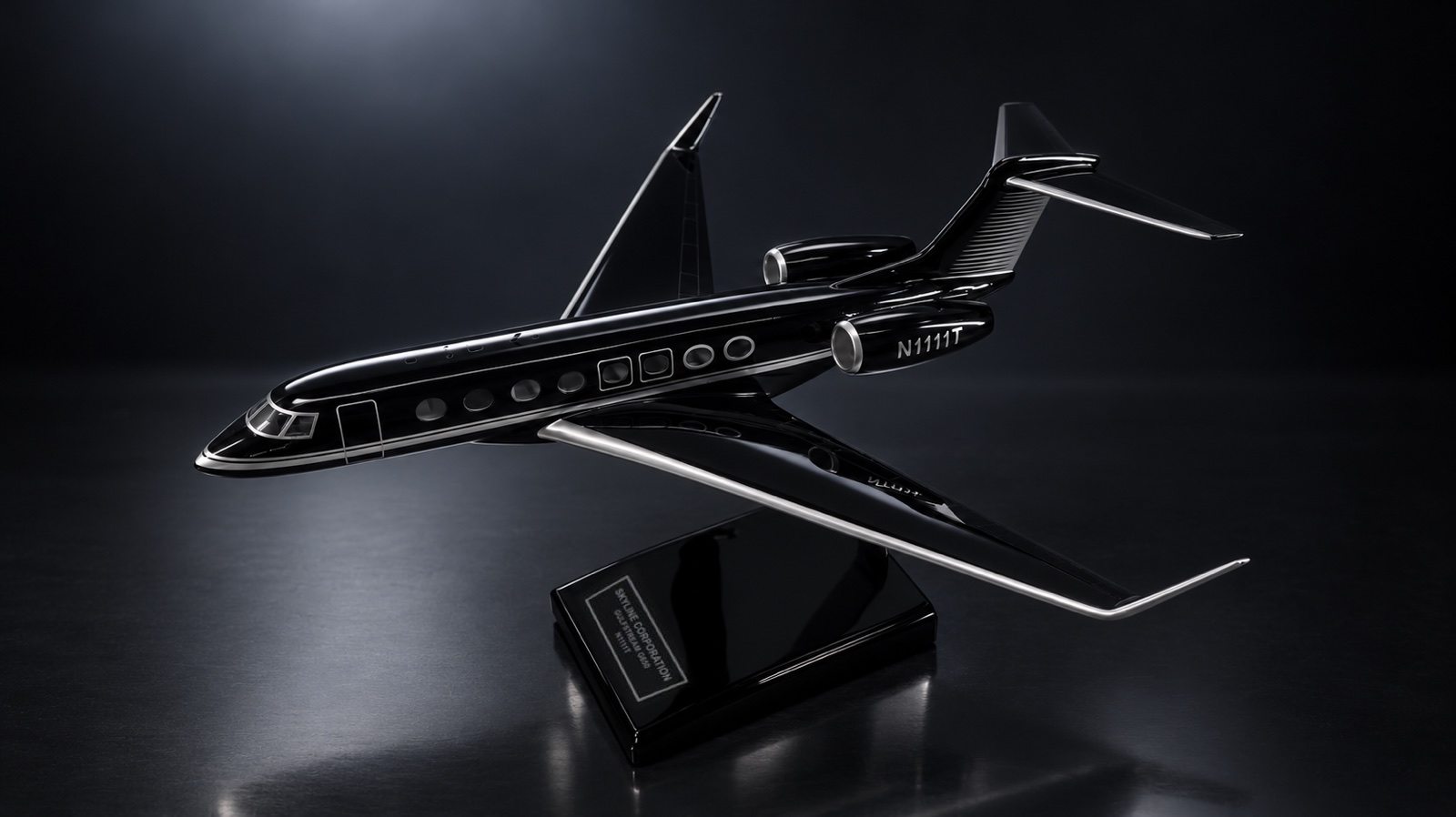 A gloss-black Gulfstream G650 business jet scale model on a black display stand